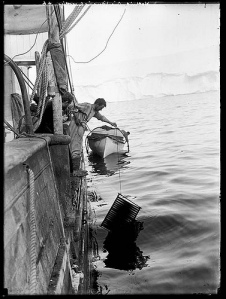 Frank Hurley washing cinematograph film on the "Aurora" from the collection of the State Lbrary of New South Wales